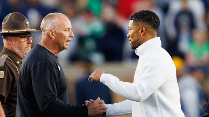 Notre Dame head coach Marcus Freeman, right, and NC State head coach Dave Doeren shake hands after Notre Dame won an NCAA football game 36-7 against NC State at Notre Dame Stadium on Saturday, Oct. 11, 2025, in South Bend. Notre Dame head coach Marcus Freeman, right, and NC State head coach Dave Doeren shake hands after Notre Dame won an NCAA football game 36-7 against NC State at Notre Dame Stadium on Saturday, Oct. 11, 2025, in South Bend.