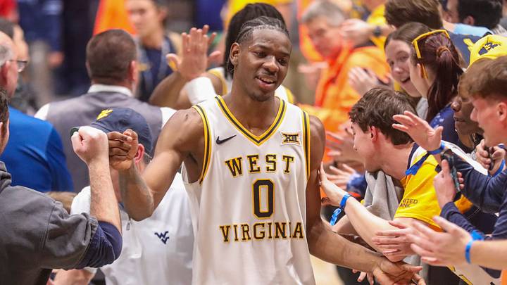 Mar 6, 2026; Morgantown, West Virginia, USA; West Virginia Mountaineers forward Brenen Lorient (0) celebrates with fans after defeating the UCF Knights at Hope Coliseum. Mandatory Credit: Ben Queen-Imagn Images
