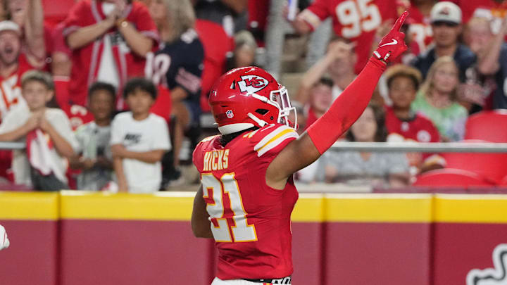 Aug 22, 2024; Kansas City, Missouri, USA; Kansas City Chiefs safety Jaden Hicks (21) celebrates against the Chicago Bears after recovering a fumble during the first half at GEHA Field at Arrowhead Stadium. Mandatory Credit: Denny Medley-Imagn Images