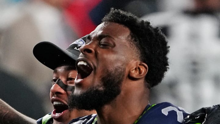 Seattle Seahawks cornerback Devon Witherspoon celebrates after a play during the fourth quarter.