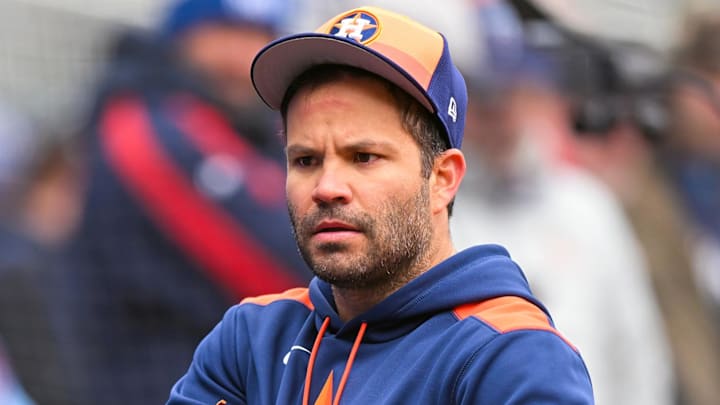 Apr 3, 2025; Minneapolis, Minnesota, USA;  Houston Astros outfielder Jose Altuve (27) adjusts his batting gloves before going to shag balls during batting practice before a game against the Minnesota Twins at Target Field