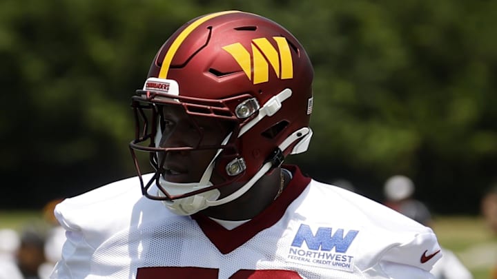 Washington Commanders offensive tackle Laremy Tunsil stands on the field on day one of minicamp at Commanders Park. Washington Commanders offensive tackle Laremy Tunsil stands on the field on day one of minicamp at Commanders Park.