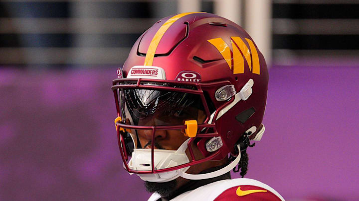 Washington Commanders quarterback Jayden Daniels practices before the game at U.S. Bank Stadium. Washington Commanders quarterback Jayden Daniels practices before the game at U.S. Bank Stadium.