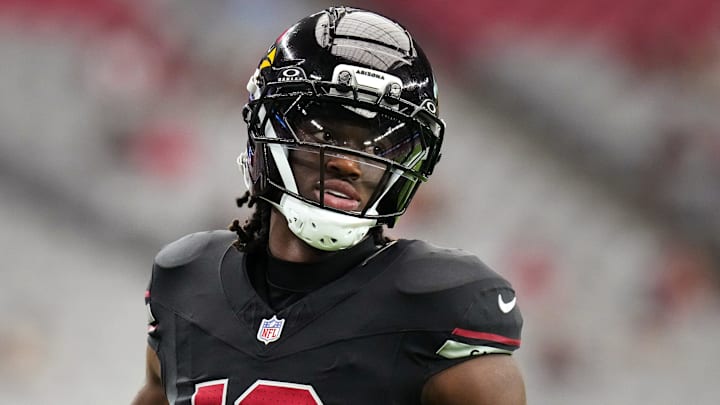 Arizona Cardinals receiver Marvin Harrison Jr. (18) warms up before their game against the Tennessee Titans at State Farm Stadium in Glendale on Oct. 5, 2025. Arizona Cardinals receiver Marvin Harrison Jr. (18) warms up before their game against the Tennessee Titans at State Farm Stadium in Glendale on Oct. 5, 2025.