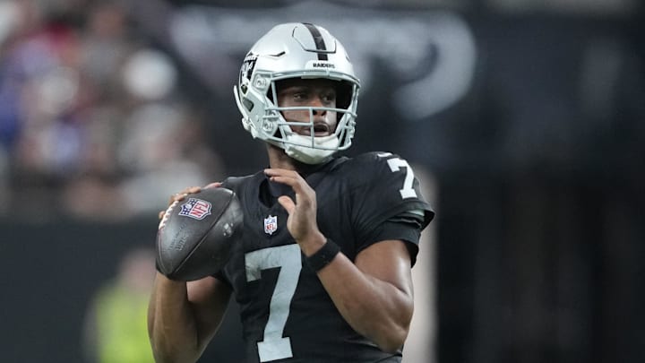Dec 28, 2025; Paradise, Nevada, USA; Las Vegas Raiders quarterback Geno Smith (7) looks to throw in the third quarter against the New York Giants at Allegiant Stadium. Mandatory Credit: Kirby Lee-Imagn Images