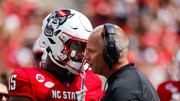 Sep 14, 2024; Raleigh, North Carolina, USA; North Carolina State Wolfpack tight end Justin Joly (15) and head coach Dave Doeren talk during the second half against the Louisiana Tech Bulldogs at Carter-Finley Stadium. Mandatory Credit: Jaylynn Nash-Imagn Images Sep 14, 2024; Raleigh, North Carolina, USA; North Carolina State Wolfpack tight end Justin Joly (15) and head coach Dave Doeren talk during the second half against the Louisiana Tech Bulldogs at Carter-Finley Stadium. Mandatory Credit: Jaylynn Nash-Imagn Images