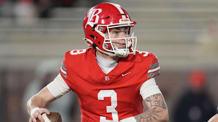 Baylor's Briggs Cherry (3) looks for an open receiver while pressured by McCallie's Cooper Gentle (35) during the TSSAA Division II-AAA high school football Bluecross Bowl on Thursday, Dec. 5, 2024, in Chattanooga, Tenn.