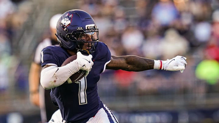 Sep 20, 2025; East Hartford, Connecticut, USA; Connecticut Huskies wide receiver Skyler Bell (1) runs the ball against et Ball State Cardinals in the second half at Pratt & Whitney Stadium at Rentschler Field. Mandatory Credit: David Butler II-Imagn Images