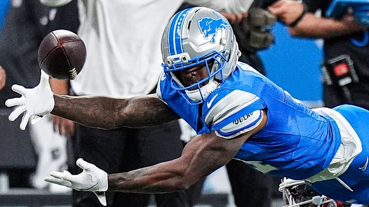 Detroit Lions cornerback D.J. Reed (4) catches for an interception against Cleveland Browns wide receiver Jerry Jeudy (3) during the first half at Ford Field in Detroit on Sunday, Sept. 28, 2025.