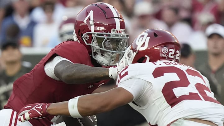 Oklahoma cornerback Peyton Bowen (22)  tackles Alabama's Isaiah Horton 