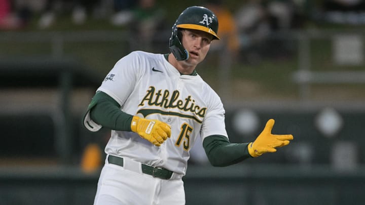 Apr 24, 2025; West Sacramento, California, USA; Athletics outfielder Seth Brown (15) motions to his team mates after hitting a double against the Texas Rangers during the second inning at Sutter Health Park. Mandatory Credit: Ed Szczepanski-Imagn Images