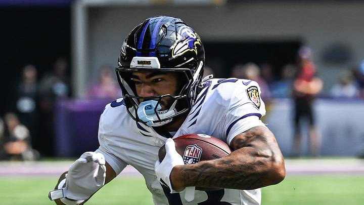 Aug 22, 2026; Minneapolis, Minnesota, USA;  Baltimore Ravens wide receiver Elijah Sarratt (13) runs after the catch as Minnesota Vikings safety Kahlef Hailassie (25) looks to make the tackle during the fourth quarter at U.S. Bank Stadium.  Mandatory Credit: Jeffrey Becker-Imagn Images