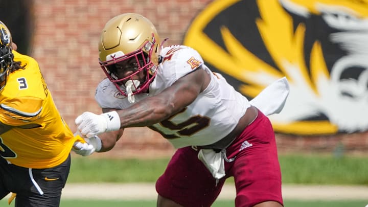 Sep 14, 2024; Columbia, Missouri, USA; Missouri Tigers wide receiver Luther Burden III (3) runs the ball as Boston College Eagles defensive end Quintayvious Hutchins (15) attempts the tackle during the second half at Faurot Field at Memorial Stadium. Mandatory Credit: Denny Medley-Imagn Images