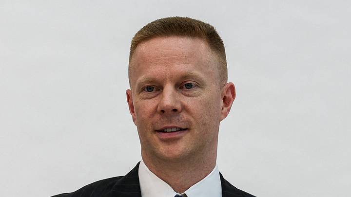 New Orlando Magic head coach Sean Sweeney poses for portraits before his introductory press conference.