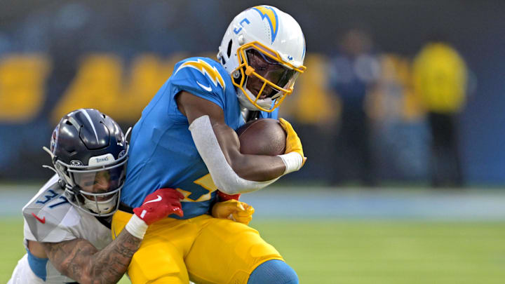 Nov 10, 2024; Inglewood, California, USA; Tennessee Titans safety Amani Hooker (37) takes down Los Angeles Chargers wide receiver Joshua Palmer (5) after a first down in the second half at SoFi Stadium. Mandatory Credit: Jayne Kamin-Oncea-Imagn Images Nov 10, 2024; Inglewood, California, USA; Tennessee Titans safety Amani Hooker (37) takes down Los Angeles Chargers wide receiver Joshua Palmer (5) after a first down in the second half at SoFi Stadium. Mandatory Credit: Jayne Kamin-Oncea-Imagn Images
