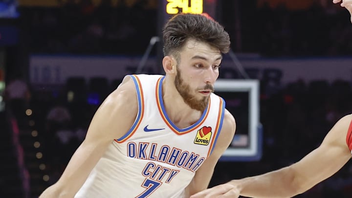Oct 9, 2024; Oklahoma City, Oklahoma, USA; Oklahoma City Thunder forward Chet Holmgren (7) drives around Houston Rockets guard Reed Sheppard (15) during the second quarter at Paycom Center. Mandatory Credit: Alonzo Adams-Imagn Images