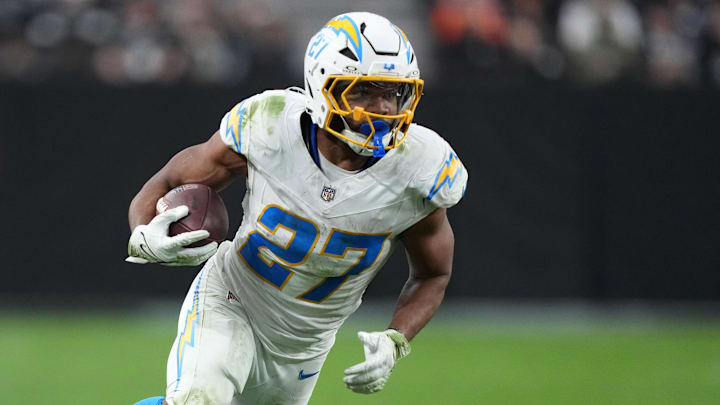 Jan 5, 2025; Paradise, Nevada, USA; Los Angeles Chargers running back J.K. Dobbins (27) carries the ball against the Las Vegas Raiders in the second half at Allegiant Stadium. Mandatory Credit: Kirby Lee-Imagn Images Jan 5, 2025; Paradise, Nevada, USA; Los Angeles Chargers running back J.K. Dobbins (27) carries the ball against the Las Vegas Raiders in the second half at Allegiant Stadium. Mandatory Credit: Kirby Lee-Imagn Images