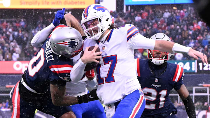 New England Patriots cornerback Christian Gonzalez (0) pushes Buffalo Bills quarterback Josh Allen (17) out of bounds  during the second half at Gillette Stadium.