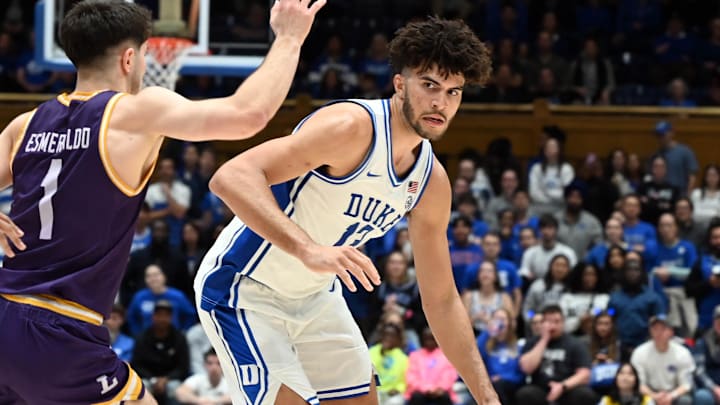 Dec 16, 2025; Durham, North Carolina, USA; Duke Blue Devils forward Cameron Boozer (12) controls the ball in front of Lipscomb Bisons guard Mateo Esmeraldo (1) during the second half at Cameron Indoor Stadium. The Blue Devils won 97-73. Mandatory Credit: Rob Kinnan-Imagn Images Dec 16, 2025; Durham, North Carolina, USA; Duke Blue Devils forward Cameron Boozer (12) controls the ball in front of Lipscomb Bisons guard Mateo Esmeraldo (1) during the second half at Cameron Indoor Stadium. The Blue Devils won 97-73. Mandatory Credit: Rob Kinnan-Imagn Images