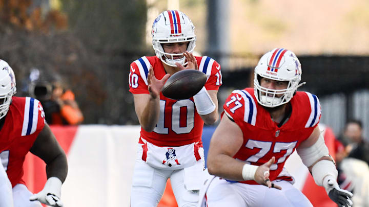 Dec 1, 2024; Foxborough, Massachusetts, USA; New England Patriots quarterback Drake Maye (10) takes a snap during the first half against the Indianapolis Colts at Gillette Stadium. Mandatory Credit: Eric Canha-Imagn Images