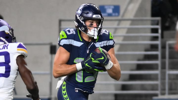 Aug 10, 2023; Seattle, Washington, USA; Seattle Seahawks wide receiver Jake Bobo (19) runs the ball in for a touchdown past Minnesota Vikings cornerback Andrew Booth Jr. (23) during the second half at Lumen Field. Mandatory Credit: Steven Bisig-Imagn Images