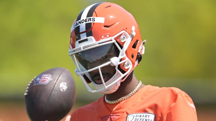 May 10, 2025; Berea, OH, USA; Cleveland Browns quarterback Shedeur Sanders (12) talks to a coach during rookie minicamp at CrossCountry Mortgage Campus. Mandatory Credit: Ken Blaze-Imagn Images May 10, 2025; Berea, OH, USA; Cleveland Browns quarterback Shedeur Sanders (12) talks to a coach during rookie minicamp at CrossCountry Mortgage Campus. Mandatory Credit: Ken Blaze-Imagn Images
