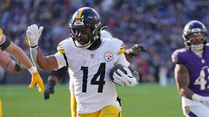 Dec 7, 2025; Baltimore, Maryland, USA; Pittsburgh Steelers running back Kenneth Gainwell (14) runs with the ball against the Baltimore Ravens for a touchdown during the first half at M&T Bank Stadium. Mandatory Credit: Mitch Stringer-Imagn Images