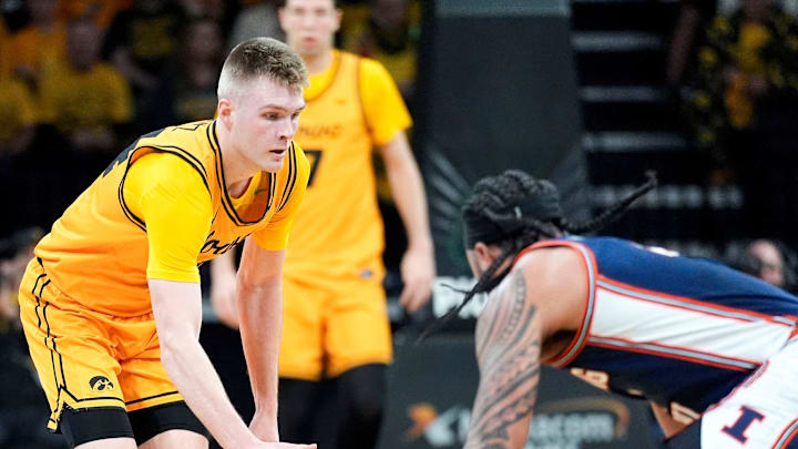 Iowa guard Bennett Stirtz (14) reaches for a loose ball against the Illinois Fighting Illini Jan. 11, 2026 at Carver-Hawkeye Arena in Iowa City, Iowa.