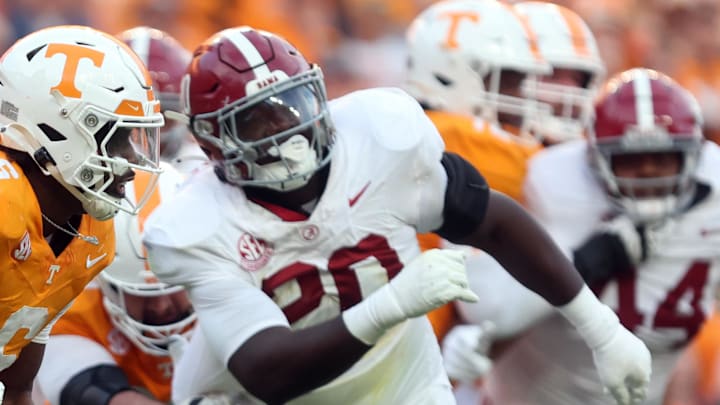 Oct 19, 2024; Knoxville, Tennessee, USA; Tennessee Volunteers running back Dylan Sampson (6) runs the ball against Alabama Crimson Tide defensive lineman Jah-Marien Latham (20) in the third quarter at Neyland Stadium. Mandatory Credit: Alan Poizner-Imagn Images