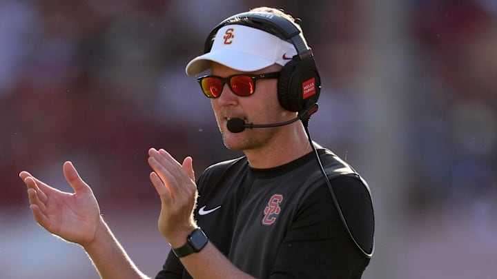 Aug 30, 2025; Los Angeles, California, USA; Southern California Trojans head coach Lincoln Riley watches from the sidelines against the Missouri State Bears in the first half at United Airlines Field at Los Angeles Memorial Coliseum. Mandatory Credit: Kirby Lee-Imagn Images
