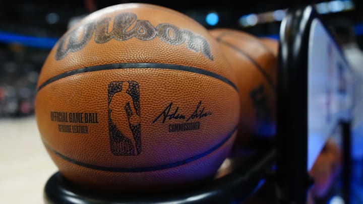 Mar 15, 2025; Denver, Colorado, USA; General view of a warm up Wilson NBA basketball before the game between the Washington Wizards against the Denver Nuggets at Ball Arena. Mandatory Credit: Ron Chenoy-Imagn Images