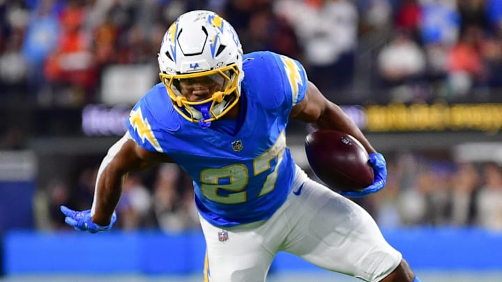 Nov 17, 2024; Inglewood, California, USA; Los Angeles Chargers running back J.K. Dobbins (27) runs the ball ahead of Cincinnati Bengals cornerback Cam Taylor-Britt (29) to score a touchdow during the second half at SoFi Stadium. Mandatory Credit: Gary A. Vasquez-Imagn Images Nov 17, 2024; Inglewood, California, USA; Los Angeles Chargers running back J.K. Dobbins (27) runs the ball ahead of Cincinnati Bengals cornerback Cam Taylor-Britt (29) to score a touchdow during the second half at SoFi Stadium. Mandatory Credit: Gary A. Vasquez-Imagn Images