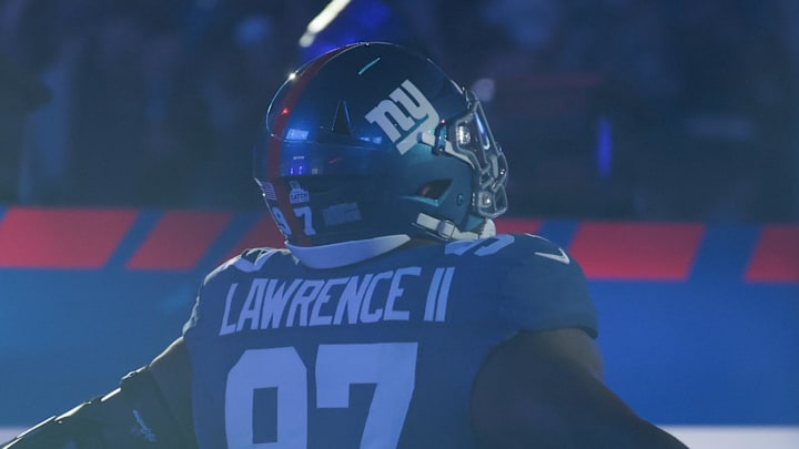 Oct 9, 2025; East Rutherford, New Jersey, USA; New York Giants defensive tackle Dexter Lawrence II (97) runs onto the field prior to the game against the Philadelphia Eagles at MetLife Stadium. Mandatory Credit: Vincent Carchietta-Imagn Images