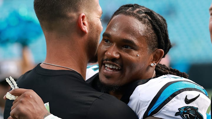 Carolina Panthers running back Rico Dowdle and head coach Dave Canales
