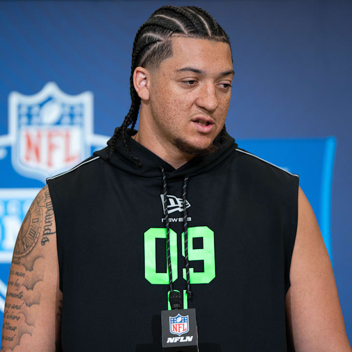 Memphis offensive lineman Travis Burke (OL09) speaks to members of the media during the NFL Combine.