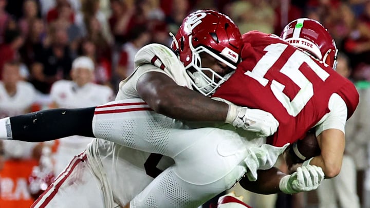 Alabama Crimson Tide quarterback Ty Simpson (15) is tackled by Oklahoma Sooners defensive lineman David Stone (0) Alabama Crimson Tide quarterback Ty Simpson (15) is tackled by Oklahoma Sooners defensive lineman David Stone (0)