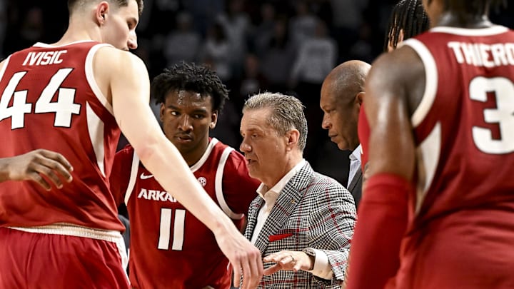 Arkansas Razorbacks coach John Calipari speaks in the huddle during a time-out in the second half against the Texas A&M Aggies at Reed Arena.