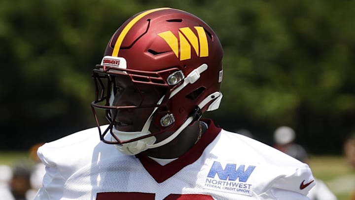 Washington Commanders offensive tackle Laremy Tunsil stands on the field on day one of minicamp. Washington Commanders offensive tackle Laremy Tunsil stands on the field on day one of minicamp.