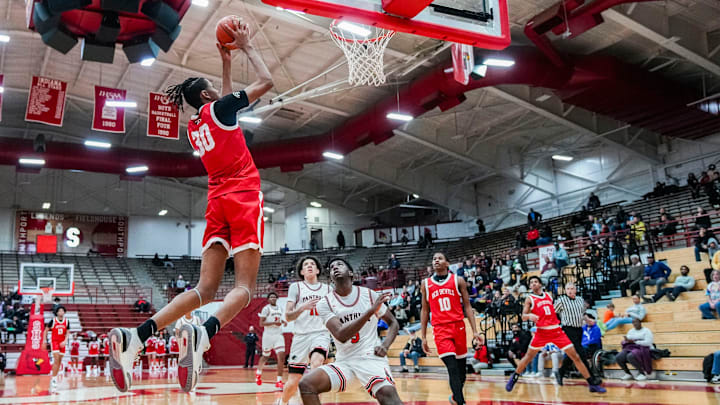Pike Red Devils center Isaiah Hill (30) dunks the ball