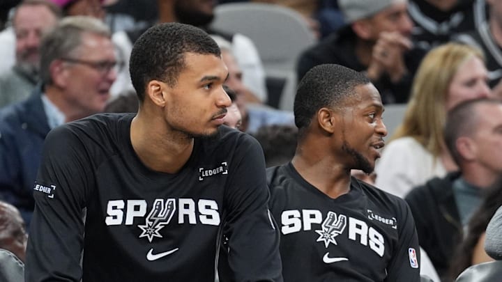 Mar 8, 2026; San Antonio, Texas, USA;  San Antonio Spurs forward Victor Wembanyama (1) and guard De'aaron Fox (4) on the bench in the second half against the Houston Rockets at Frost Bank Center. Mandatory Credit: Daniel Dunn-Imagn Images