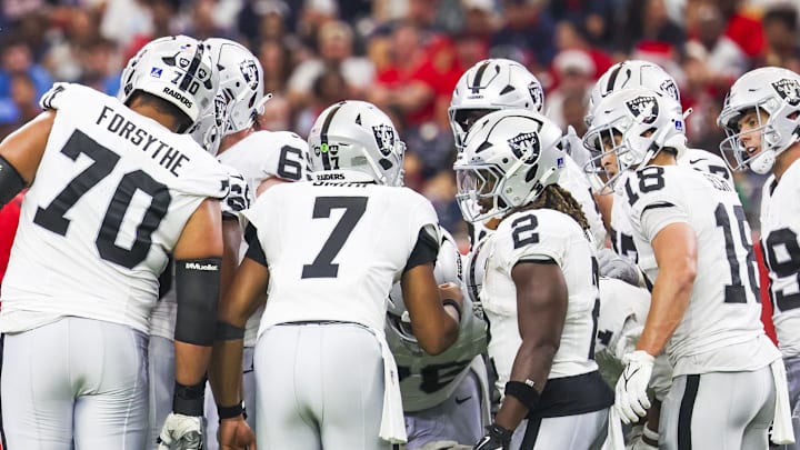 Dec 21, 2025; Houston, Texas, USA; Las Vegas Raiders quarterback Geno Smith (7) stands in the huddle with offensive tackle Stone Forsythe (70), running back Ashton Jeanty (2), wide receiver Jack Bech (18) and tight end Brock Bowers (89) during the second quarter against the Houston Texans at NRG Stadium. Mandatory Credit: Thomas Shea-Imagn Images