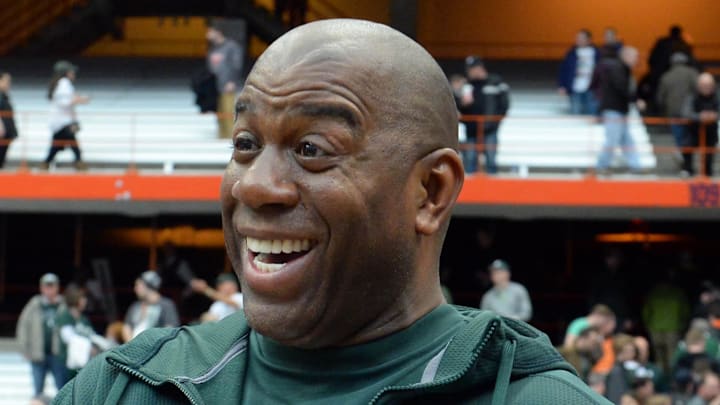 Mar 29, 2015; Syracuse, NY, USA; Michigan State Spartans former player Magic Johnson celebrates after the game against the Louisville Cardinals in the finals of the east regional of the 2015 NCAA Tournament at Carrier Dome. The Michigan State Spartans won 76-70.Mandatory Credit: Rich Barnes-Imagn Images Mar 29, 2015; Syracuse, NY, USA; Michigan State Spartans former player Magic Johnson celebrates after the game against the Louisville Cardinals in the finals of the east regional of the 2015 NCAA Tournament at Carrier Dome. The Michigan State Spartans won 76-70.Mandatory Credit: Rich Barnes-Imagn Images
