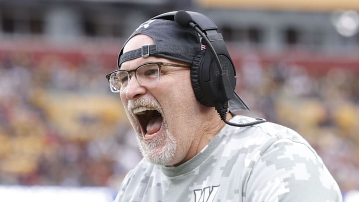 Nov 10, 2024; Landover, Maryland, USA; Washington Commanders head coach Dan Quinn celebrates on the sidelines after an interception pass against the Pittsburgh Steelers during the second half at Northwest Stadium. Mandatory Credit: Amber Searls-Imagn Images Nov 10, 2024; Landover, Maryland, USA; Washington Commanders head coach Dan Quinn celebrates on the sidelines after an interception pass against the Pittsburgh Steelers during the second half at Northwest Stadium. Mandatory Credit: Amber Searls-Imagn Images