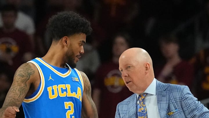 Mar 7, 2026; Los Angeles, California, USA; UCLA Bruins guard Donovan Dent (2) talks with head coach Mick Cronin against the Southern California Trojans first half at Galen Center. Mandatory Credit: Kirby Lee-Imagn Images Mar 7, 2026; Los Angeles, California, USA; UCLA Bruins guard Donovan Dent (2) talks with head coach Mick Cronin against the Southern California Trojans first half at Galen Center. Mandatory Credit: Kirby Lee-Imagn Images
