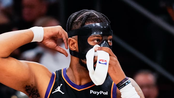 Feb 10, 2026; Phoenix, Arizona, USA; Phoenix Suns guard Jordan Goodwin (23) puts on a face shield in the first half of the game at Mortgage Matchup Center. Mandatory Credit: Arianna Grainey-Imagn Images