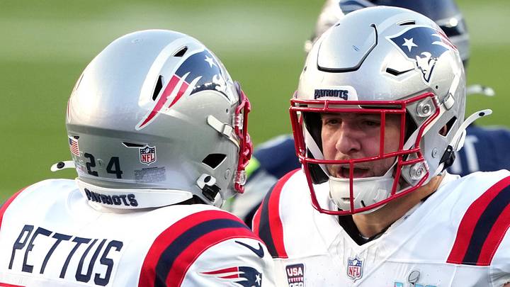 Feb 8, 2026; Santa Clara, CA, USA; New England Patriots safety Dell Pettus (24) is congratulated by linebacker Chad Muma (49) after a tackle against the Seattle Seahawks during the first quarter in Super Bowl LX at Levi's Stadium. Mandatory Credit: Darren Yamashita-Imagn Images