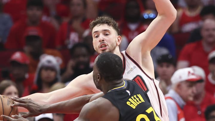 May 4, 2025; Houston, Texas, USA; Houston Rockets center Alperen Sengun (28) deflects as pass by Golden State Warriors forward Draymond Green (23) during game seven of the first round for the 2025 NBA Playoffs at Toyota Center. Mandatory Credit: Troy Taormina-Imagn Images May 4, 2025; Houston, Texas, USA; Houston Rockets center Alperen Sengun (28) deflects as pass by Golden State Warriors forward Draymond Green (23) during game seven of the first round for the 2025 NBA Playoffs at Toyota Center. Mandatory Credit: Troy Taormina-Imagn Images