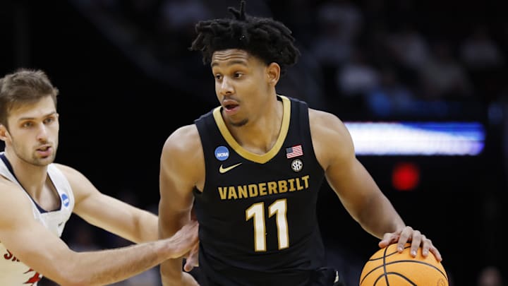 Mar 21, 2025; Cleveland, OH, USA; Vanderbilt Commodores guard AJ Hoggard (11) dribbles the ball defended by St. Mary's Gaels guard Augustas Marciulionis (3) in the second half at Rocket Arena. Mandatory Credit: Rick Osentoski-Imagn Images Mar 21, 2025; Cleveland, OH, USA; Vanderbilt Commodores guard AJ Hoggard (11) dribbles the ball defended by St. Mary's Gaels guard Augustas Marciulionis (3) in the second half at Rocket Arena. Mandatory Credit: Rick Osentoski-Imagn Images