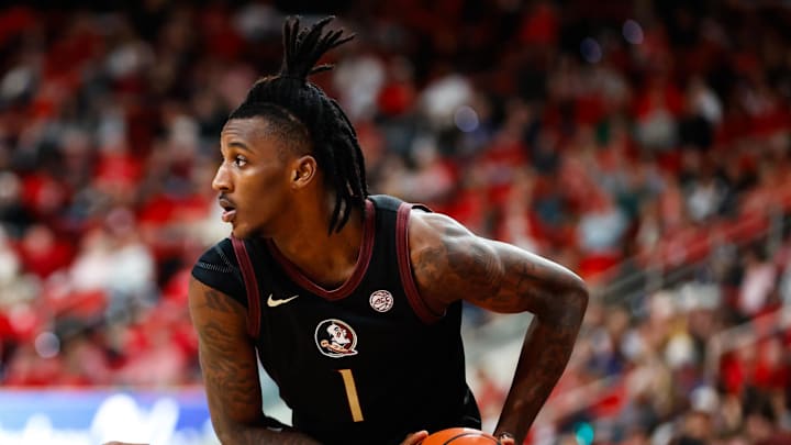Dec 7, 2024; Raleigh, North Carolina, USA; Florida State Seminoles guard Jamir Watkins (1) holds the ball during the second half of the game against North Carolina State Wolfpack at Lenovo Center. Mandatory Credit: Jaylynn Nash-Imagn Images