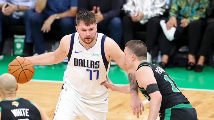 Jun 9, 2024; Boston, Massachusetts, USA; Dallas Mavericks guard Luka Doncic (77) dribbles the ball against Boston Celtics guard Payton Pritchard (11) during the fourth quarter in game two of the 2024 NBA Finals at TD Garden. Mandatory Credit: Peter Casey-USA TODAY Sports